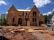 New construction home in progress shows framing and structural elements at 6740 Pannell Rd, Buford, GA 30518