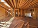 View of framing with exposed beams and wood stud walls within home construction at 6740 Pannell Rd, Buford, GA 30518