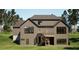 New home's rear exterior featuring a walkout basement, deck, stairs, and large windows overlooking the backyard at 6740 Pannell Rd, Buford, GA 30518