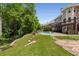 Extensive backyard with a pool, patio, and mature trees, offering a tranquil setting for outdoor living and relaxation at 10410 High Falls Cir, Alpharetta, GA 30022