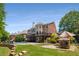 Lush backyard with a pool, lounge area, and ample space for recreation, creating a serene outdoor retreat at 10410 High Falls Cir, Alpharetta, GA 30022