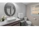 Well-lit bathroom featuring a unique vanity mirror, vessel sink, and modern fixtures at 10410 High Falls Cir, Alpharetta, GA 30022