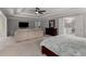 Large primary bedroom with sitting area and trey ceiling, plus ensuite bathroom at 10410 High Falls Cir, Alpharetta, GA 30022