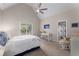 Bright bedroom with a vaulted ceiling, ceiling fan, and an ensuite bathroom at 10410 High Falls Cir, Alpharetta, GA 30022