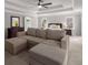 Spacious main bedroom features a sitting area, ceiling fan, and abundant natural light from many windows at 10410 High Falls Cir, Alpharetta, GA 30022