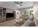 Open concept living room featuring lots of natural light, comfortable furniture, and modern decor at 10410 High Falls Cir, Alpharetta, GA 30022