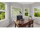 Bright office featuring lots of light, a dark wood desk, and a comfortable work space at 10410 High Falls Cir, Alpharetta, GA 30022
