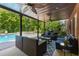 Covered patio with an inground pool, ceiling fans, and lots of seating at 10410 High Falls Cir, Alpharetta, GA 30022
