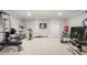Basement fitness room featuring exercise equipment and space for a complete home gym setup at 12980 Overlook Pass, Roswell, GA 30075