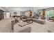 Relaxing basement with a large sectional sofa, seating area, and decor at 12980 Overlook Pass, Roswell, GA 30075