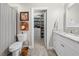Bathroom leads into a walk-in closet and features a granite countertop vanity and a shower-tub combination at 12980 Overlook Pass, Roswell, GA 30075