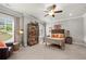 Nicely decorated bedroom with a ceiling fan, neutral walls, and coordinated furnishings creating a comfortable space at 12980 Overlook Pass, Roswell, GA 30075