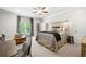 Bright bedroom with a comfortable bed, wood floors, and lots of natural light creating a tranquil space at 12980 Overlook Pass, Roswell, GA 30075