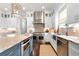 Modern kitchen with granite countertops, stainless steel appliances, and custom cabinetry at 12980 Overlook Pass, Roswell, GA 30075