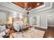 Spacious main bedroom with hardwood floors, sitting area, and bathroom access at 12980 Overlook Pass, Roswell, GA 30075