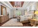 Comfortable main bedroom with a decorative wood ceiling, and neutral colors at 12980 Overlook Pass, Roswell, GA 30075