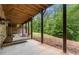 Covered patio with a porch swing offering a relaxing outdoor space at 12980 Overlook Pass, Roswell, GA 30075