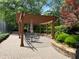 Covered pergola with seating to relax and enjoy the outdoors at 12980 Overlook Pass, Roswell, GA 30075