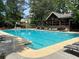Relaxing community pool with lounge chairs and covered pavilion for enjoying the outdoors at 12980 Overlook Pass, Roswell, GA 30075