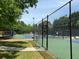 Fenced community tennis courts perfect for outdoor recreation at 12980 Overlook Pass, Roswell, GA 30075