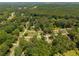 An aerial view showcasing the homes nestled among mature trees in a desirable neighborhood at 1429 Smithson Dr, Lithonia, GA 30058