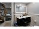 Updated bathroom featuring modern vanity, large mirror, and stylish tile work at 1429 Smithson Dr, Lithonia, GA 30058