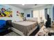 Bright bedroom featuring a bed, a nightstand, a desk and light blue walls at 1429 Smithson Dr, Lithonia, GA 30058