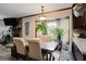 Bright dining space with plants, window, and gray floors and accents creating a clean and inviting space at 1429 Smithson Dr, Lithonia, GA 30058