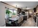 Kitchen with eating area, dark cabinetry, light countertop, and natural light from the window view providing a cozy feel at 1429 Smithson Dr, Lithonia, GA 30058