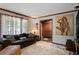 Inviting living room featuring a comfortable sofa, large window, and elegant decor at 1429 Smithson Dr, Lithonia, GA 30058