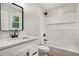A modern bathroom featuring a shower-tub combo, and a vanity with black hardware at 3952 Leisure Se Ct, Conyers, GA 30013