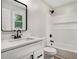 Bathroom with laminate floors, modern fixtures, a shower/tub combo and a double-hung window at 3952 Leisure Se Ct, Conyers, GA 30013