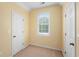 Neutral bedroom featuring neutral paint, carpet, and window at 4942 Brown Leaf Dr, Powder Springs, GA 30127