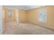 Large bedroom with lots of natural light and neutral carpet at 4942 Brown Leaf Dr, Powder Springs, GA 30127