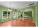 A spacious dining room features hardwood floors and views of the backyard and open living area at 4942 Brown Leaf Dr, Powder Springs, GA 30127