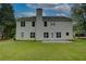 Exterior shot showing the home's rear facade, highlighting its architectural details and open backyard at 4942 Brown Leaf Dr, Powder Springs, GA 30127