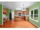 Spacious kitchen featuring stainless steel appliances, an island, wooden cabinets and natural light at 4942 Brown Leaf Dr, Powder Springs, GA 30127