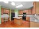 Modern kitchen featuring an island, stainless steel appliances, hardwood floors and plenty of storage at 4942 Brown Leaf Dr, Powder Springs, GA 30127