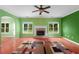 Bright living room featuring hardwood floors, brick fireplace and windows that give natural light at 4942 Brown Leaf Dr, Powder Springs, GA 30127