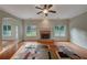 Spacious living room features a brick fireplace, hardwood floors and ample natural light at 4942 Brown Leaf Dr, Powder Springs, GA 30127