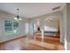 Spacious living room with hardwood floors, lots of windows, and a cozy fireplace at 4942 Brown Leaf Dr, Powder Springs, GA 30127