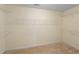 Spacious walk-in closet with white shelving and neutral carpet at 4942 Brown Leaf Dr, Powder Springs, GA 30127