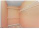 Bright walk-in closet featuring white shelving and neutral carpet at 4942 Brown Leaf Dr, Powder Springs, GA 30127