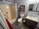 Full bathroom featuring a shower-tub combo, toilet, and a wooden vanity sink at 135 Governors Rdg, Auburn, GA 30011