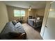 Bedroom with neutral walls, ceiling fan, window with curtains, and a bed with metal frame at 135 Governors Rdg, Auburn, GA 30011