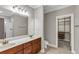 Bright bathroom features double sinks, wood cabinets, and a walk-in closet at 1628 Briarcliff Ne Rd # 15, Atlanta, GA 30306