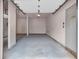 Empty two-car garage with gray painted walls and concrete floor at 1628 Briarcliff Ne Rd # 15, Atlanta, GA 30306