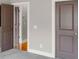 Hallway featuring gray walls and carpet with open doorways and views at 1628 Briarcliff Ne Rd # 15, Atlanta, GA 30306