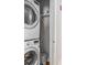Efficient laundry room with stacked washer and dryer maximizing space at 1628 Briarcliff Ne Rd # 15, Atlanta, GA 30306