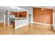 Bright open-concept living room with hardwood floors, stainless steel appliances, and a modern design at 1628 Briarcliff Ne Rd # 15, Atlanta, GA 30306